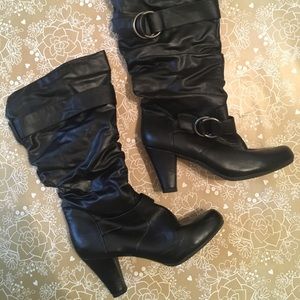 High heeled faux leather boots.